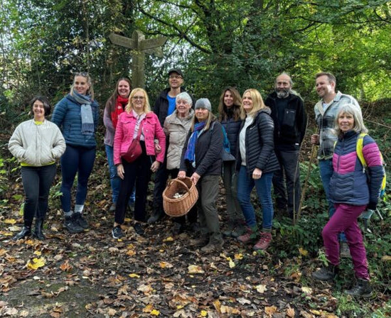 James Hill and participants posing together during a hands-on wild food foraging course