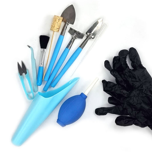 10 piece planting tool kit including pruning scissors, tweezers, a brush, a wood and cork tamper, trowel, rake, transplanting trowel, pipette, a soil scoop, and a cleaning pump all in the colour blue with a pair of black nitrile powder free gloves